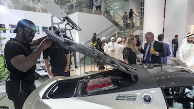 Visitors get a closer look at the cars.