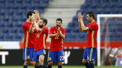 Spain’s players celebrate after match. Leonhard Foeger / Reuters