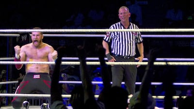 Sami Zayn celebrates winning his match during the WWE Live event at Zayed Sports City. Christopher Pike / The National