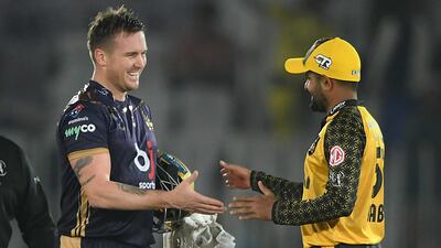 Quetta Gladiators' Jason Roy, left, scored an unbeaten century to complete a record chase against Babar Azam's Peshawar Zalmi in their PSL 2023 match in Rawalpindi on Wednesday, March 8, 2023. AFP