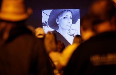People attend a vigil for late cinematographer Halyna Hutchins, who was fatally shot on the film set of 'Rust'. Reuters