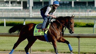 American Pharoah runs on the track during the morning training for the Kentucky Derby at Churchill Downs on April 29. Andy Lyons / Getty Images