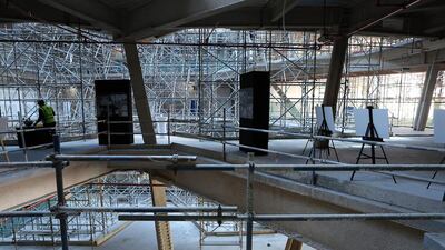 At the moment the interior of The Opus remains a forest of scaffolding and the only guide to its eventual appearance are the renderings produced by the architects. Pawan Singh / The National