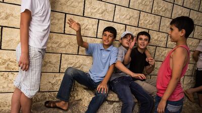 Palestinian refugees from Syria play in the streets of Shatila refugee camp, in Beirut, Lebanon. Andrew McConnell for The National