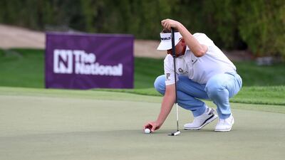 Ian Poulter putts on the 12th green. Chris Whiteoak / The National