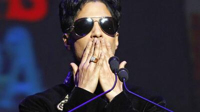 Singer Prince gestures as he announces upcoming live dates at the Apollo Theater in New York in October 2010. Lucas Jackson/ Reuters