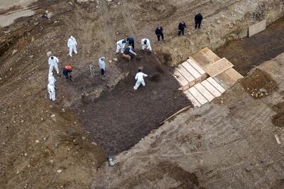 Drone pictures show bodies being buried on New York's Hart Island where the department of corrections is dealing with more burials overall, amid the coronavirus disease outbreak in New York City, on April 9, 2020. Reuters