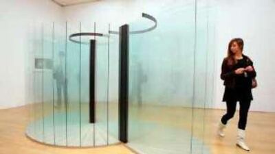 A woman studies Goshka Macuga's Deutsches Volk - Deutsche Arbeit (2008), a glass, fabric and steel sculpture which has been nominated for this year's Turner Prize.