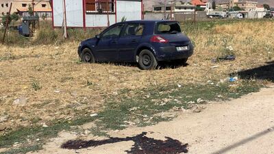 A damaged car stands near the mosque. Reuters