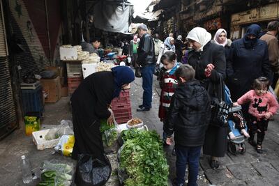 Syrians buy their daily basic food items and other necessities in one of the streets of Damascus, Syria, 05 January 2021. EPA Photo
