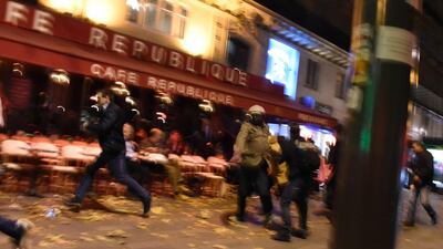 People run after hearing what is believed to be explosions or gun shots near Place de la Republique square in Paris on November 13, 2015. The attacks left 130 people dead and hundreds wounded. Dominique Faget / Agence France-Presse