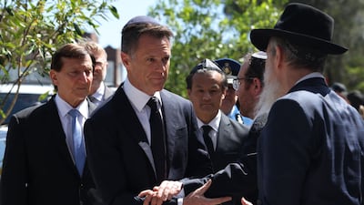 New South Wales Premier Chris Minns, centre, arrives at the funeral of Rabbi Eli Schlanger. AFP