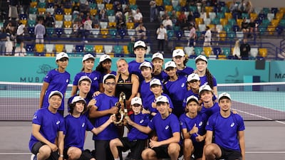 Champion Sara Bejlek with the ball boys and girls in Abu Dhabi.