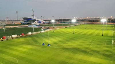 An after shot of the grass fields surrounding the main arena at Zayed Cricket Stadium.