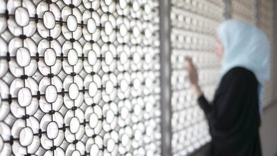 Single mother C L faces steep hospital bills after her ex-husband abandoned her and their baby. Reem Mohammed / The National