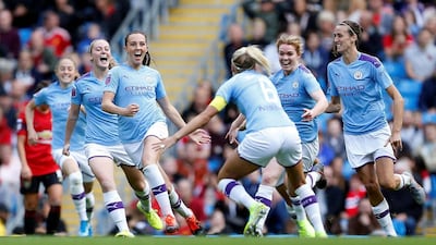 Manchester City's Caroline Weir, centre, celebrates after scoring the winning goal against Manchester United. Reuters