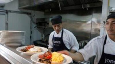 Yunib Siddiqui, front, owner of the Abu Dhabi boutique food store Jones the Grocer. Above, The store has a full-service restaurant that offers a menu of imported recipes, including one of Abu Dhabi's few English breakfasts.