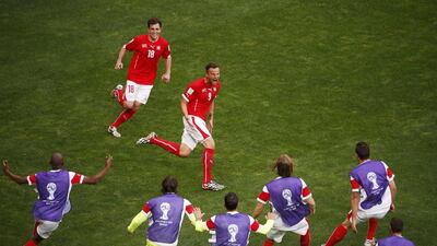 Switzerland's Haris Seferovic, near, celebrates his winning 2-1 goal in extra time against Ecuador with his teammates on Sunday at the 2014 World Cup in Brasilia, Brazil. David Gray / Reuters