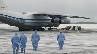 Medical staff members walking towards a military plane, which evacuated citizens of Russia and ex-Soviet countries from China's Wuhan province, the epicentre of an outbreak of the coronavirus epidemic. Reuters.