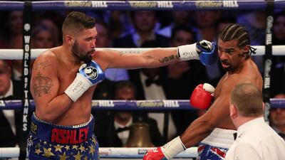 Tony Bellew delivers a straight left against David Haye . Daniel Leal-Olivas / AFP