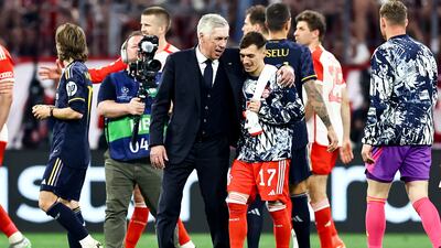 Real Madrid manager Carlo Ancelotti talks to Bayern player Bryan Zaragoza at the end of the match. EPA