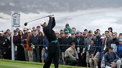 Tiger Woods hits a drive on the 14th hole during the second round of the US Open.