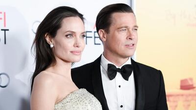 Angelina Jolie, left, and Brad Pitt arrive for AFI Fest’s opening night debut of By The Sea in Los Angeles. Richard Shotwell / Invision / AP Photo