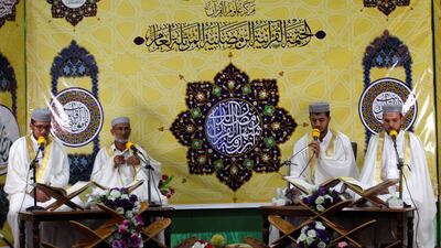 Men sit at the Al Qasim Mosque during the month of Ramadan in Hilla, Iraq. Reuters