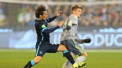 David Silva of Manchester City and Toni Kroos of Real Madrid compete for the ball during their pre-season friendly match on Friday in Melbourne. Quinn Rooney / Getty Images