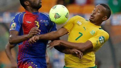 Cape Verde's Fernando Varela, left, fights for the ball with South Africa's Lehlohonolo Majoro during the opening match of the African Cup of Nations on Saturday. Armando Franca / AP Photo