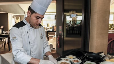 Raed Zeytoun is the head chef of Byblos Sur Mer and he leads a team of seven chefs that creates the nightly iftar at the restaurant. Here he is preparing the freekeh risotto. Victor Besa / The National