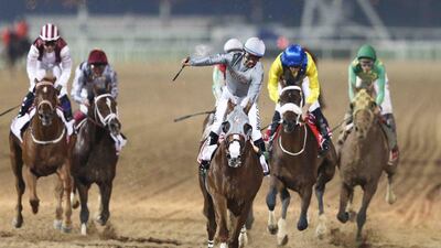 Victor Espinoza rides California Chrome to victory in the Dubai World Cup on the dirt track at Meydan Racecourse on March 26, 2016 in Dubai, United Arab Emirates. Warren Little / Getty Images