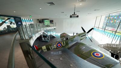 The Spitfire is displayed in a glass-fronted purpose-built gallery. PA