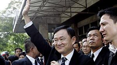 Portsmouth have denied that the former Thai Prime Minister Thaskin Shinawatra, centre, is involved in the takeover of the club.