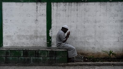 A man offer prayers before iftar in Port-au-Prince. AFP