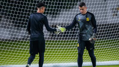 Al Ittihad goalkeepers Osama Almermesh, left, and Marcelo Grohe attend a training session. AP