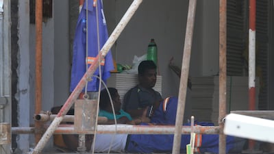 Workers enjoy their midday break at a construction site on Al Reem Island in Abu Dhabi. Ravindranath K / The National