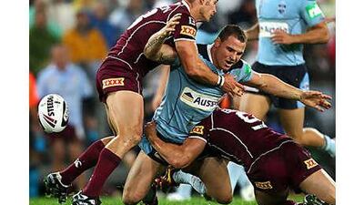 Anthony Watmough, of NSW, is thwarted by the Queensland defence during yesterday's defeat to the Maroons.