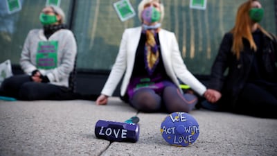 Tools that were used to smash the windows are seen in front of the protesters. Reuters