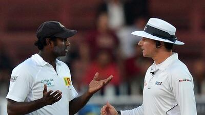 Sri Lanka captain Angelo Mathews tried to get a favourable decision on the light conditions to force an early closure of the Test as things fell apart on the final day. Ishara Kodikara / AFP