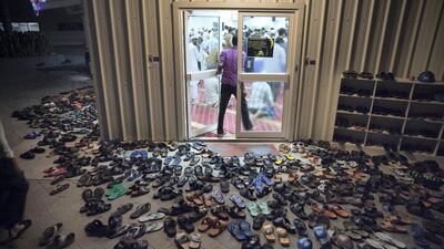 Men stream into their local mosque to join in the first morning prayer at the Saadiyat Accommodation Village on the Saadiyat Island in Abu Dhabi. July 24, 2013. Silvia Razgova / The National