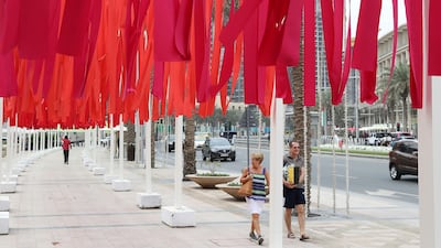 The coloured-ribbon installation has been travelling around the globe since it debuted in Tokyo in 2013. Pawan Singh / The National