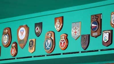 Some of the shields on display inside the Fine Ales & Wines area at the Queen Elizabeth 2 ship in Dubai. Pawan Singh / The National