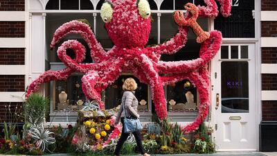 LONDON, ENGLAND - MAY 20: A person walks past a floral window display in the window of the Kiki McDonough store near Sloane Square as businesses unveil this years creations in support of the Chelsea Flower Show on May 20, 2019 in London, England. Running from May 21-25, the annual Chelsea Flower Show was started in 1913 and is one of the largest events in the horticultural calendar. (Photo by Leon Neal/Getty Images)