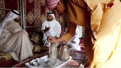 Saif Al Hamli, centre, and his family live in Al Dhafrah Marabiea, the closest residential area to Shams 1. Like many of their neighbours, the Al Hamli family keeps a traditional bedouin tent outside their home. The National