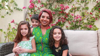 Suman Manning with her triplets, from left, Zoe, Zandar and Zara, at their Mirdif home in Dubai. Victor Besa for The National
