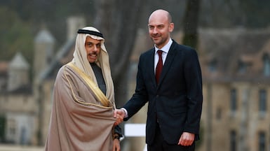 G7 host and France's Minister for Europe and Foreign Affairs Jean-Noel Barrot, right, greets Saudi Arabia's Foreign Minister Prince Faisal bin Farhan for the group's foreign ministers' meeting at Vaux-de-Cernay Abbey near Paris on March 26. Reuters