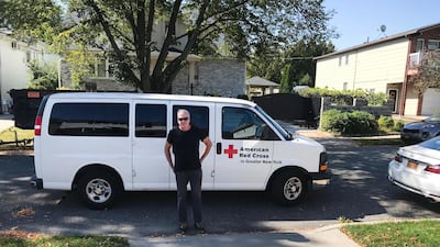Bill Chrystal and his Red Cross van. Courtesy Red Cross