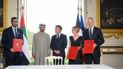 Sheikh Mohamed, Mr Macron, Dr Al Jaber, Ms Pannier-Runacher and France's Economy Minister Bruno Le Maire after the signing ceremony in Paris. Photo: Presidential Court