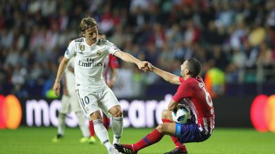 Modric with Koke of Atletico. Getty